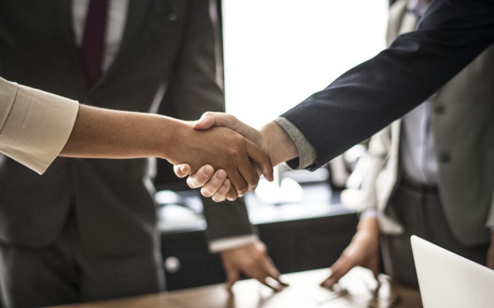 Business people shaking hands in a meeting room